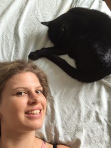 Woman's face and her black cat